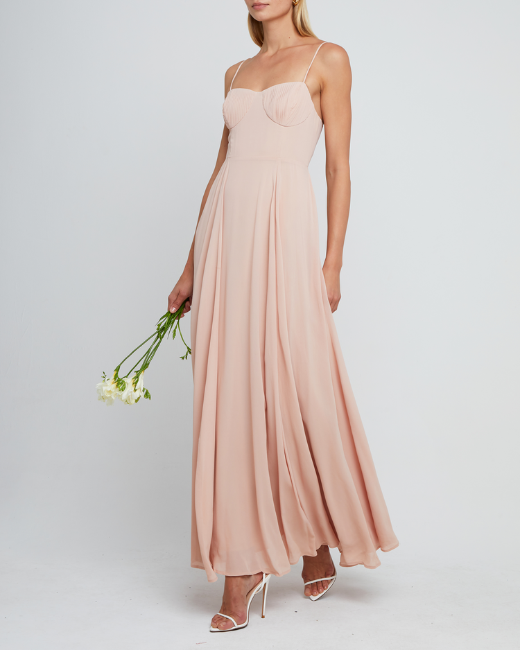Fourth image of Winslow Dress, a pink bridesmaid dress with pleated cup detail, bustier style bodice, long flowy skirt, side slit, back zipper, adjustable straps, lining, and sweetheart neckline