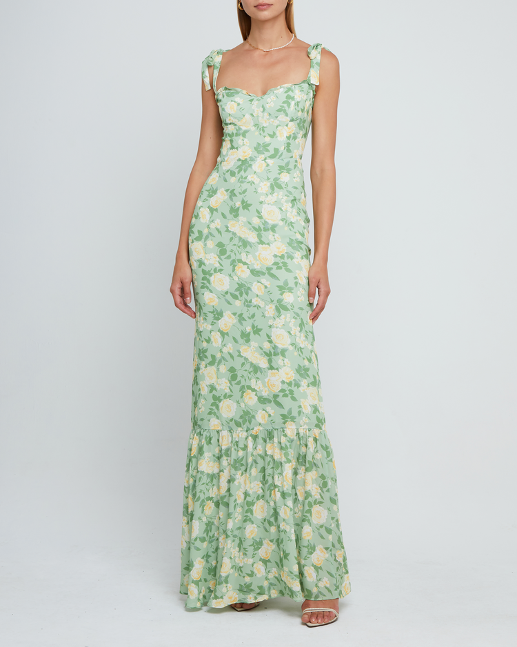Third image of La Rue Dress, a sage floral floor-length bridesmaid dress with adjustable tie straps, cup detail, neckline ruffles, tiered skirt, lining, back smocking and back zipper