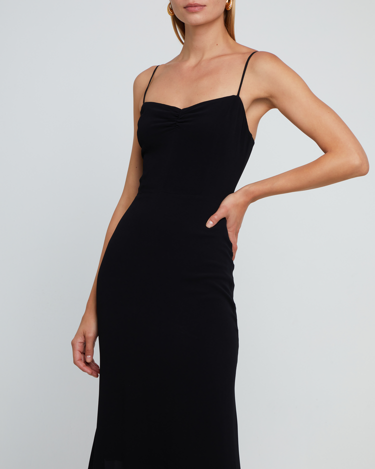 Seventh image of Evelyn Dress, a black bridesmaid maxi-length dress with ruched bust detail, sweetheart neckline, tiered skirt, back smocking, adjustable straps, back zipper, and lining