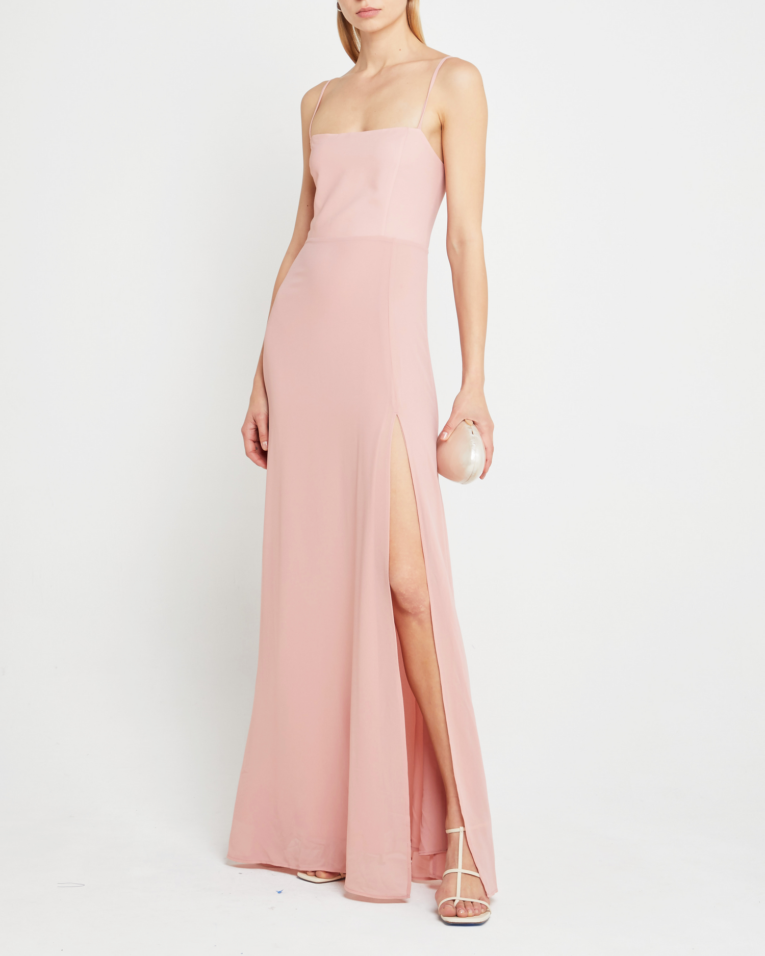 Third image of Jessica Maxi Dress, a pink wedding guest dress with back zipper, straight neckline, side slit, adjustable straps, smocked back detail, and lining