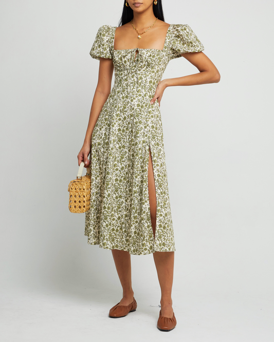 First image of Cotton Peasant Dress, a green maxi dress, tie detail, puff sleeves, short sleeves, side slit