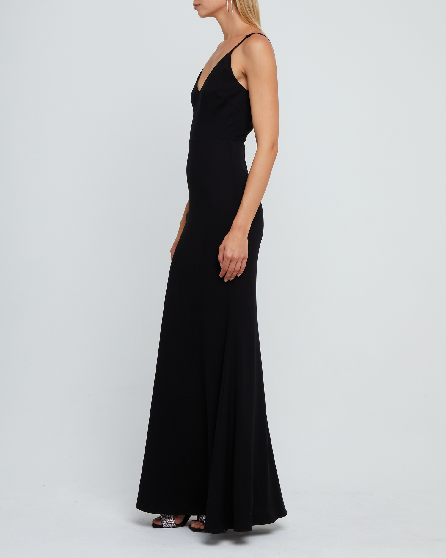 Third image of Balsam Dress, a black bridesmaid dress with deep v-neckline, adjustable straps, back zipper, low scoop back, and long skirt